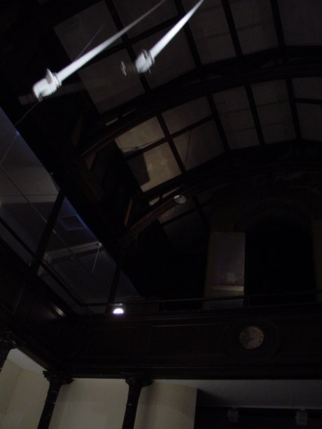 Emma Woffenden: Denied pleasure. No Horizon, part 1, 2003. The 6 metre long trapeze ended with a metal bar and swung through the space just out of reach above peoples heads.