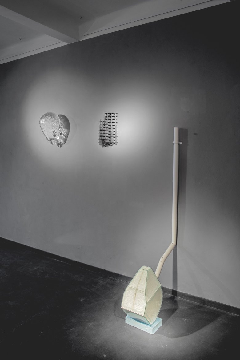 Emma Woffenden: Contact Isolation, 2019. Drained sculpture in the fore ground, shows two works on the wall by Peter Stanicky.