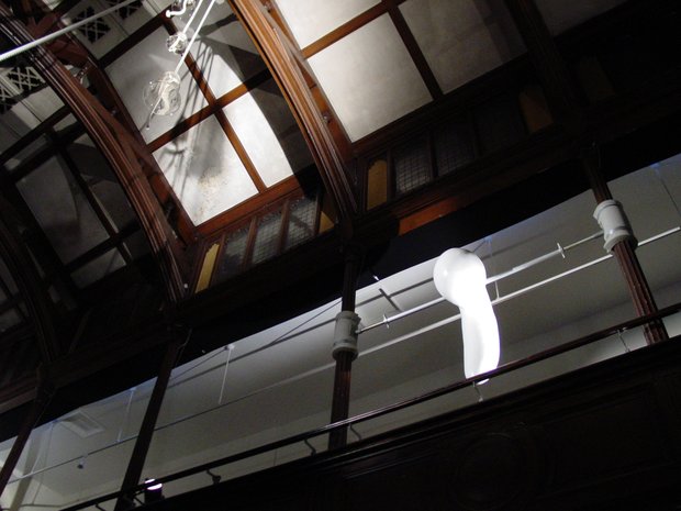Emma Woffenden: Denied pleasure. No Horizon, part 1, 2003. The 'Spinner' wedged between columns on the balcony at Fabrica. The static sculpture suggests a movement about to happen.