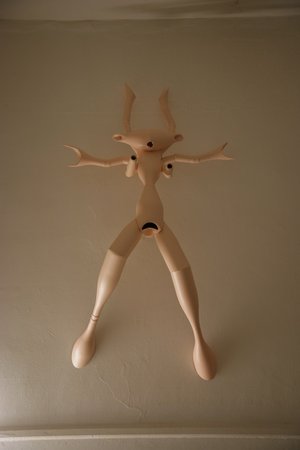 Emma Woffenden: Figurative work made from glass bottles, 2009. 'Sister', wall mounted
